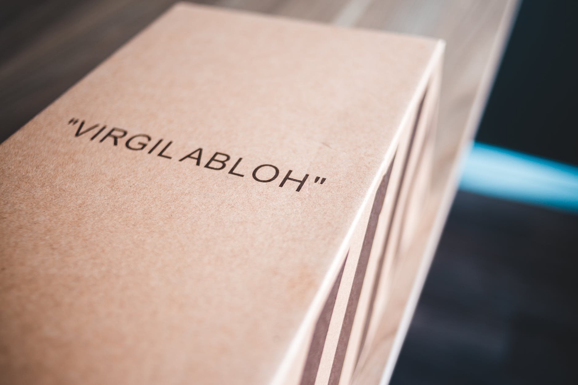 cardboard box with stripes and name